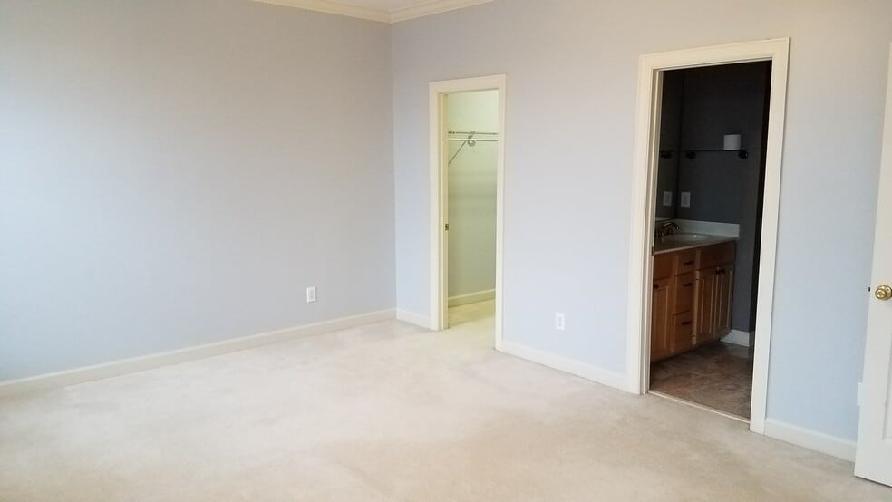Master bedroom with entrances to master bath and walk-in master closet with fresh paing - 5000 Park Ave