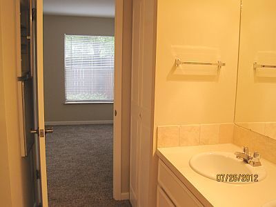 from vanity into bathroom and fenced patio - 2227 Canyon Blvd