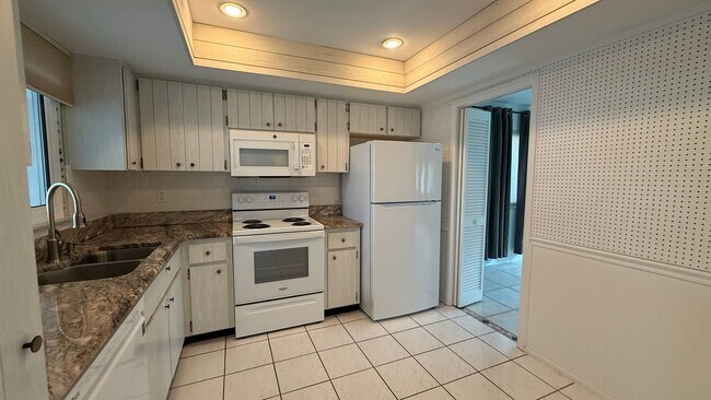 Building Photo - All inclusive 2BR/ 2B Condo in 55+ Community