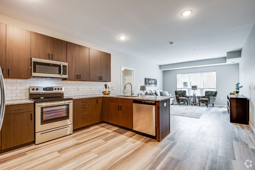 2BR, 2BA -1102SF - C1 - Kitchen and Living Room - Overlook at Crystal Lake