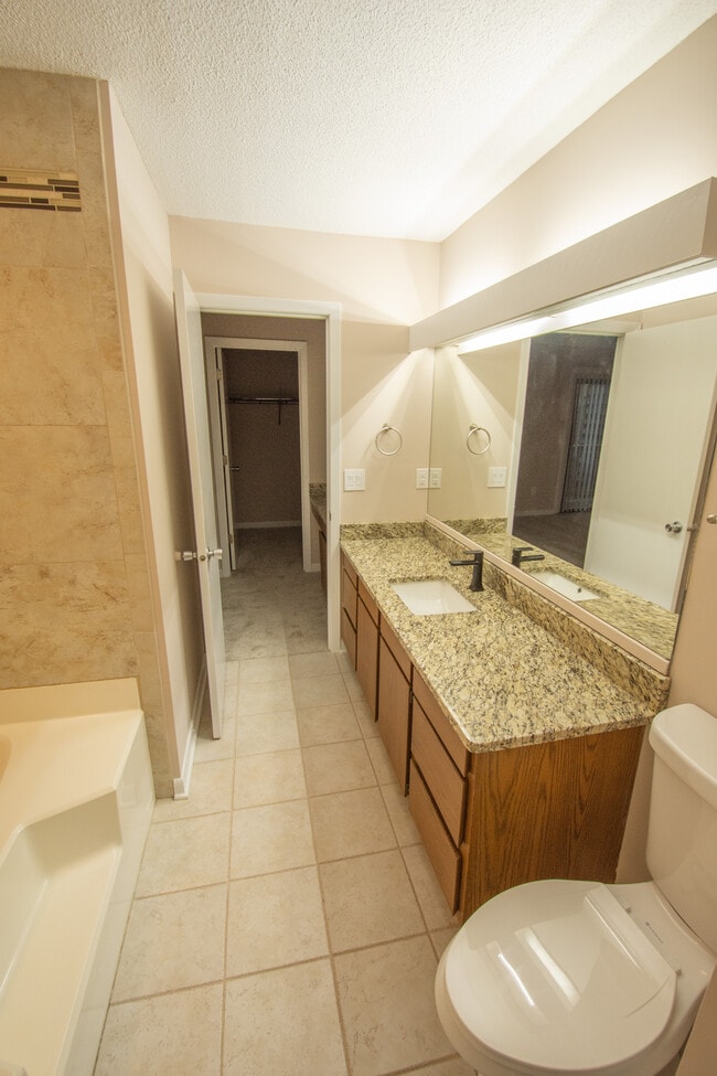 View of "Jack & Jill" Bathroom with tile floor, granite countertop, undermount sink, oversize garden - 115 Beechnut St