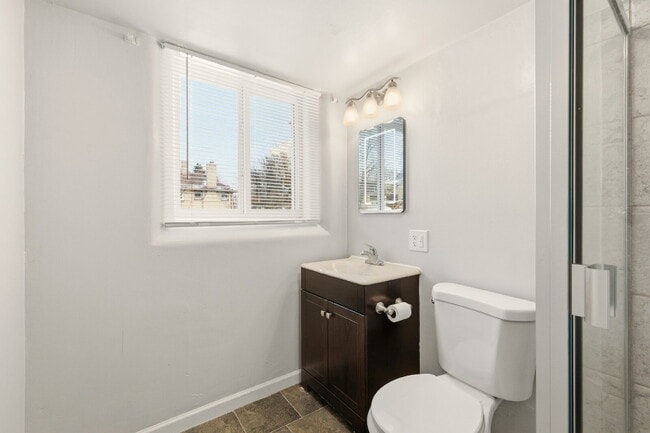 Building Photo - Price Drop! Renovated studio with garage + utilities included! Modern kitchen with island, update...