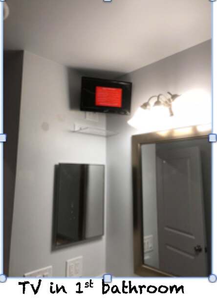 TV in bathroom - 202 W Rollin St