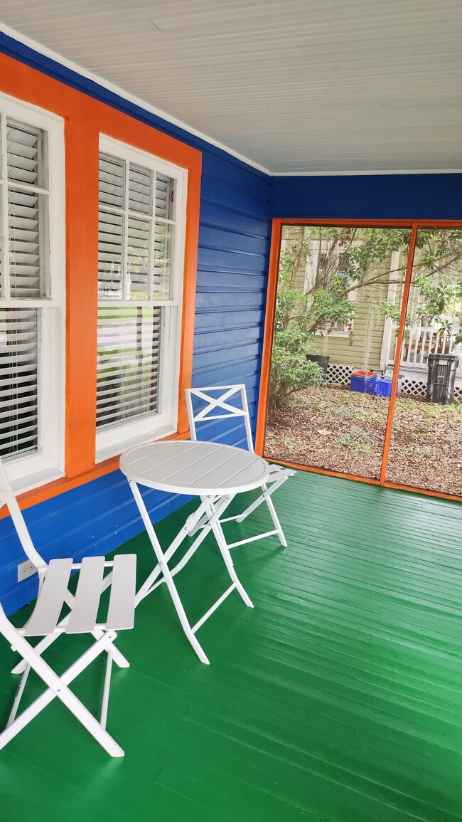 Screened in front porch as wide as the house. - 208 NW 3rd St