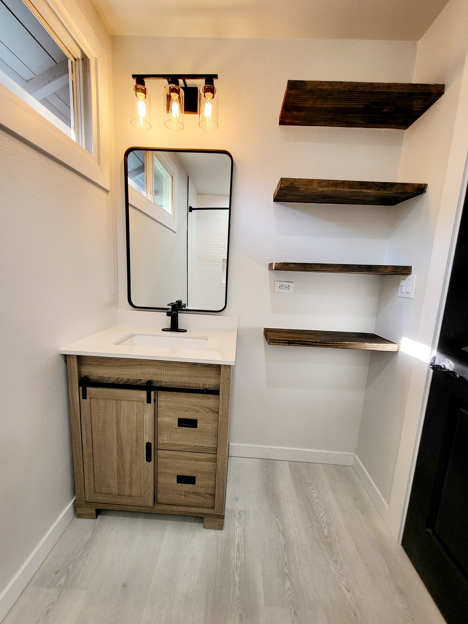 Vanity, mirror, floating shelves - 2327 Las Colinas Ave