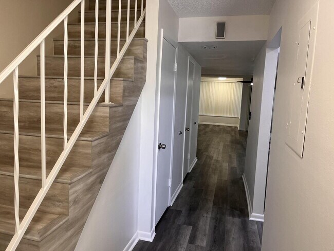 Building Photo - Two-story condominium, featuring 2 bedrooms and 2 1/2 bathrooms