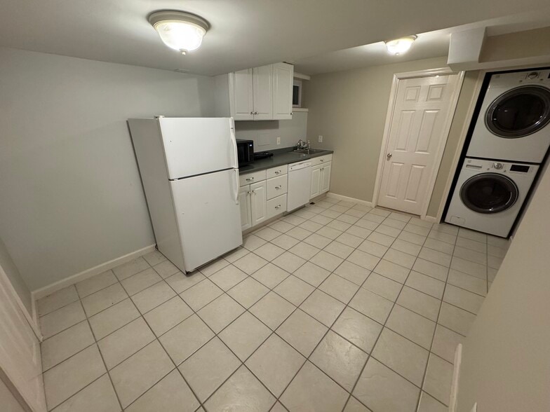 Kitchen, with tiled floor and in-unit washer/dryer - 201 E Indian Spring Dr