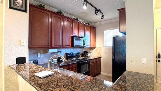 Building Photo - Move-in ready and Fully Furnished! This beautifully maintained 3-bedroom, 3-bath Condo offers a R...