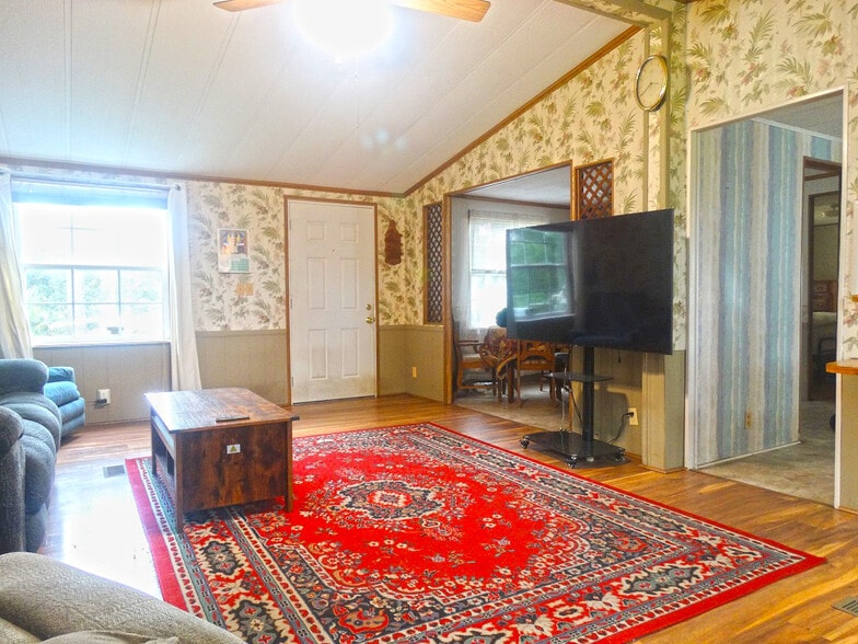 Cozy living room with cathedral ceiling - 118 W Rogers St