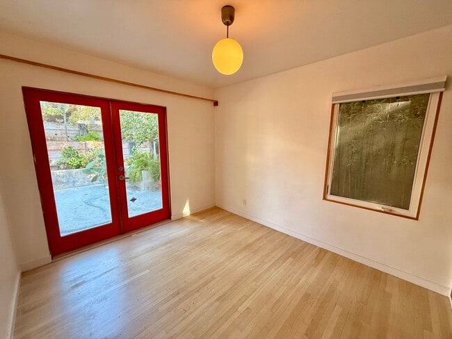 Building Photo - Hilltop Highland Park Sanctuary with Views, Private Gated Yard, In Unit Laundry, Parking & Abunda...