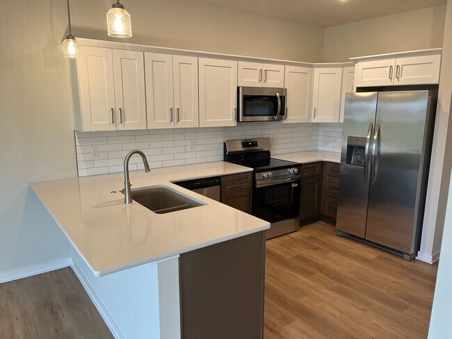 Building Photo - Spacious 5-Bedroom Duplex Near Asbury Elementary with Finished Basement & Full Amenities