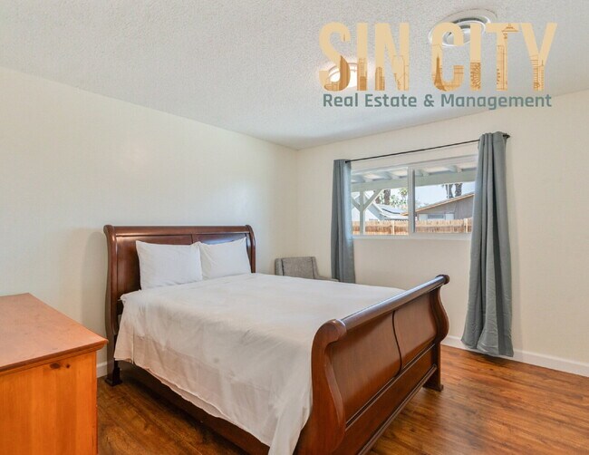 Building Photo - "Charming 4-Bedroom Retreat in Las Vegas –...