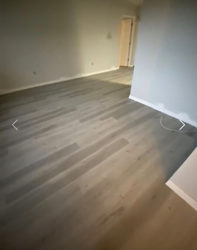 Building Photo - Available NOW! NEW FLOORS AND PAINT! Lovely 3/2 in Poinciana! HUGE fenced yard and NO CARPET!