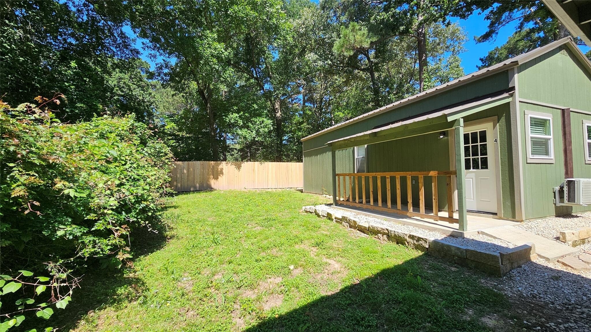 Covered porch with private yard - 23806 Brushy Woods St