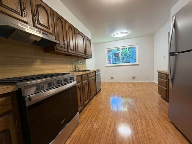 Building Photo - Spacious 4-Bedroom Home with Functional Layout, Backyard Access & Attached Garage