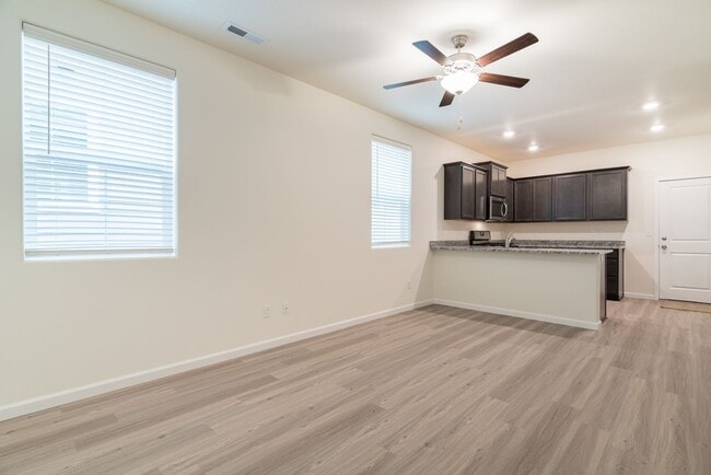 Building Photo - Super clean & spacious 4-bdrm/3-bath townhome in NE—Attached garage, great location