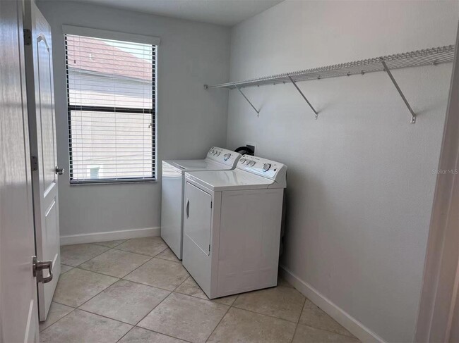 Building Photo - "Spacious 5-Bed Retreat with Elegant Hardw...