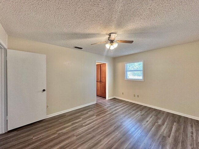 Building Photo - Spacious 4-Bedroom Home on a Corner Lot wi...