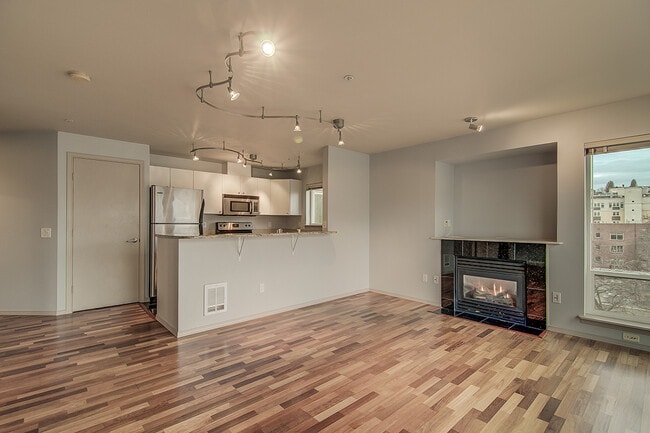 Building Photo - Top floor corner one-bedroom in the heart of it all, don't miss out, tour today!