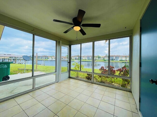 Building Photo - Updated 2-bedroom waterfront duplex with walk-in closets, enclosed Florida room, and canal views ...