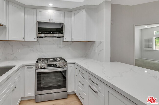 Building Photo - 4477 Woodman Ave