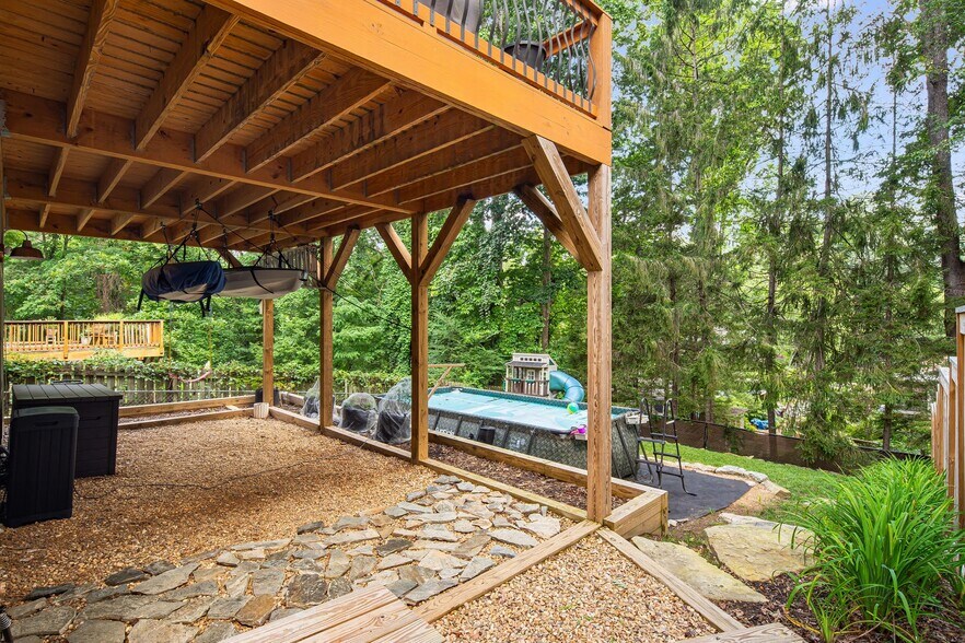 Lower deck plus leveled and terraced back yard fully fenced (pool will be replaced by stone patio). - 33 Rex Dr