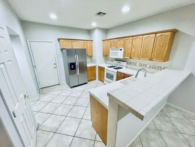 Building Photo - Guard-Gated Green Valley Ranch | Upgraded 3BR/2.5BA Townhome