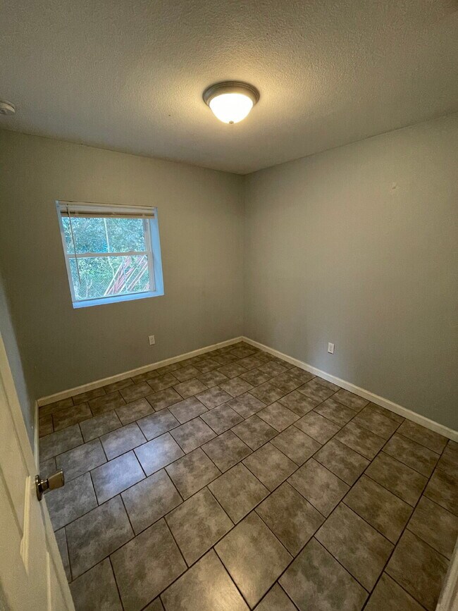 Building Photo - Open floor plan, four-bedroom two-bathroom with washer and dryer