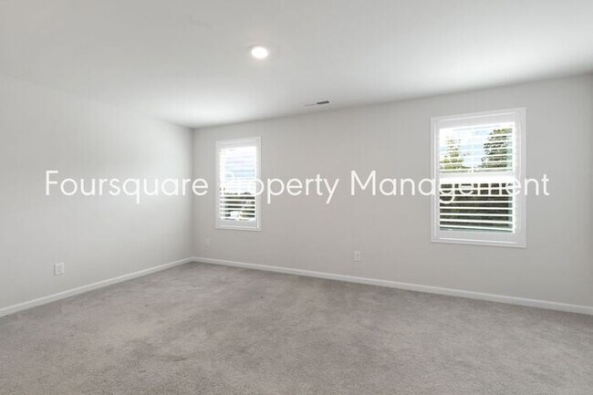 Building Photo - Stylish 3-Level Townhome with Bonus Suite, Deck & Garage – Near I-540 and Shopping