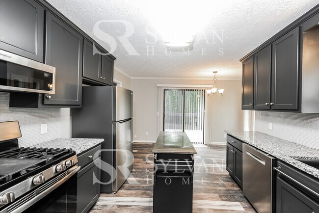 Building Photo - This lovely home is ready for your personal touch!