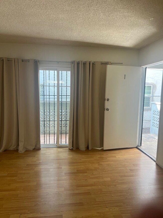 Sun blocking curtains in living room - 1937 S Bedford St