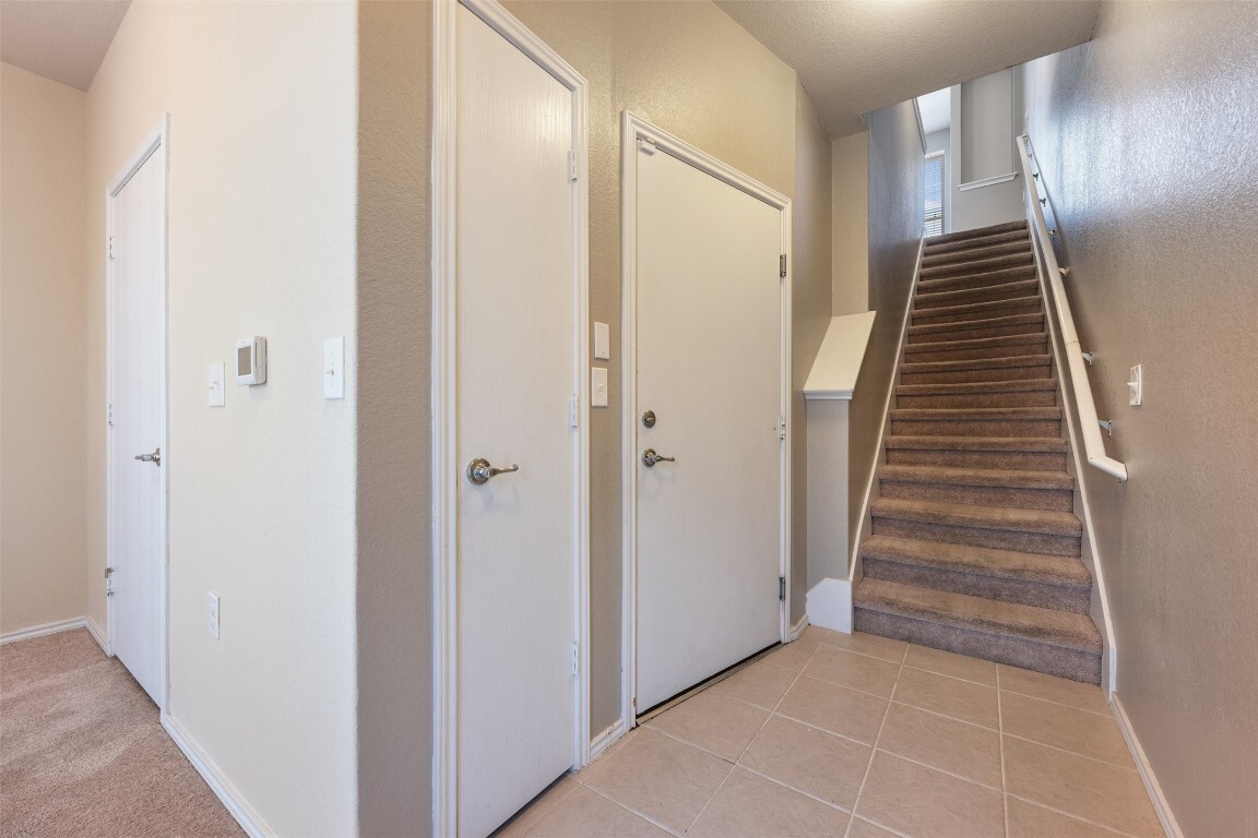 First floor hallway, door to garage, stairs to 2nd floor - 4337 Nitschke St