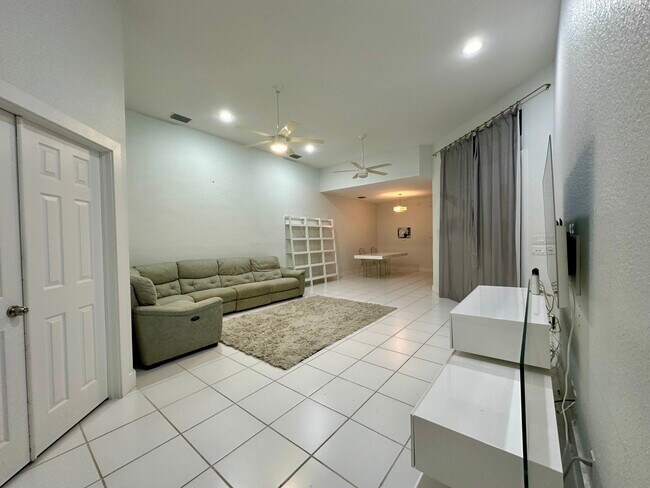 Living room and dining room with furniture - 3656 Mykonos Ct