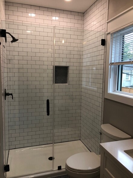 walk in shower with natural light - 1928 Harold St