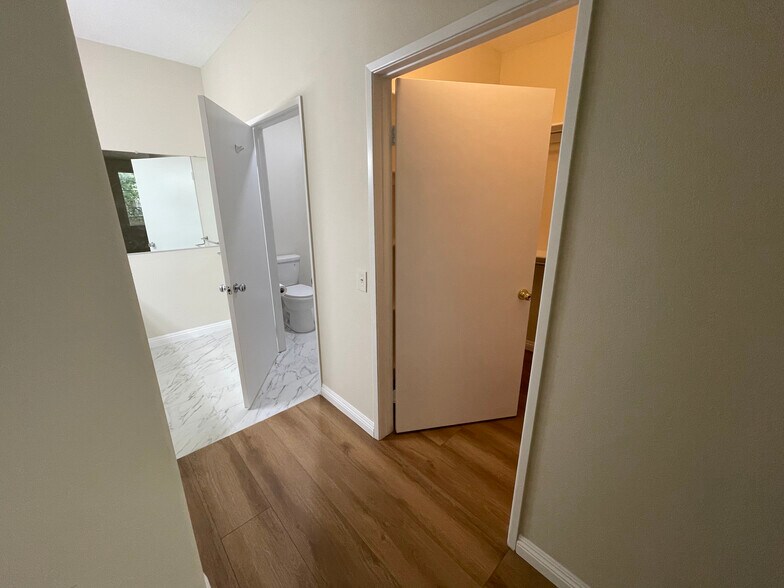 master bedroom 2 view of toilet entrance and walk in closet - 2960 Champion Way