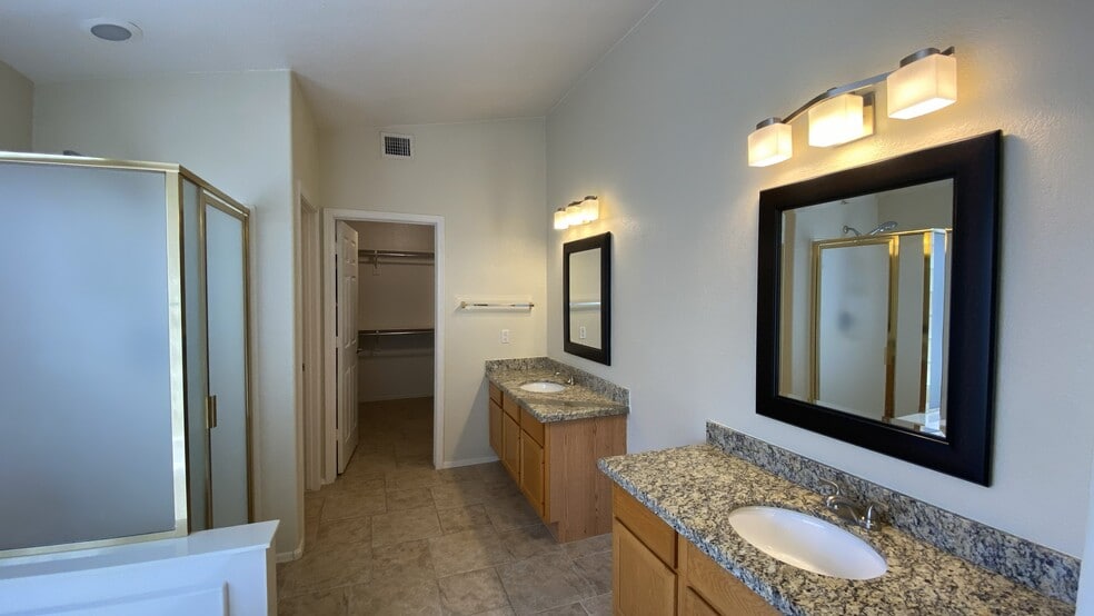 Master bathroom view of dual sinks - 6806 W Quail Ave