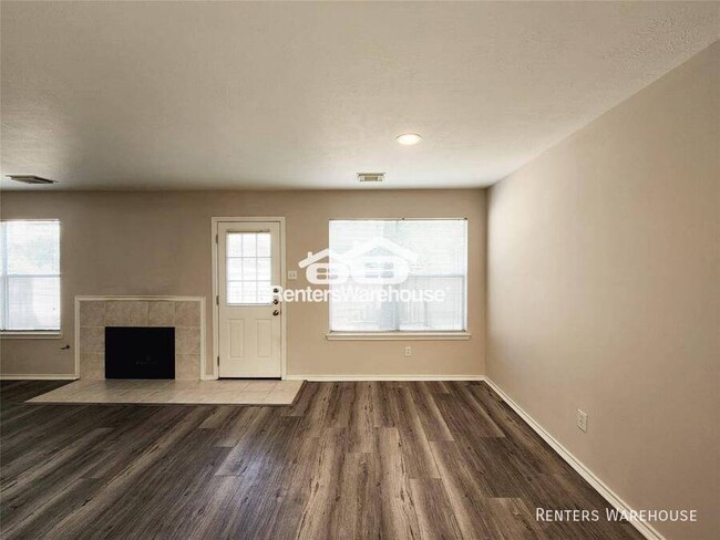 Building Photo - This gem of a townhome is nestled in the w...