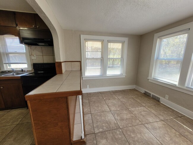 Building Photo - Four bedroom home on Indianola Ave with large yard and two decks!