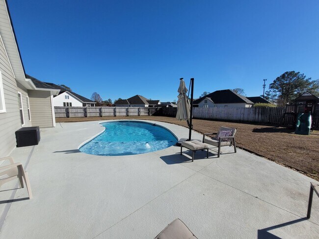Building Photo - Spacious 4BR Home with Inground Pool, Open Split Floor Plan & Side-Entry Garage