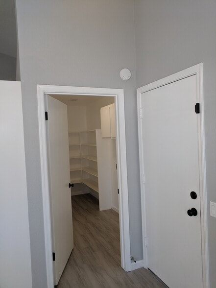 Kitchen Pantry entry and door to Garage - 14101 N 78th Dr