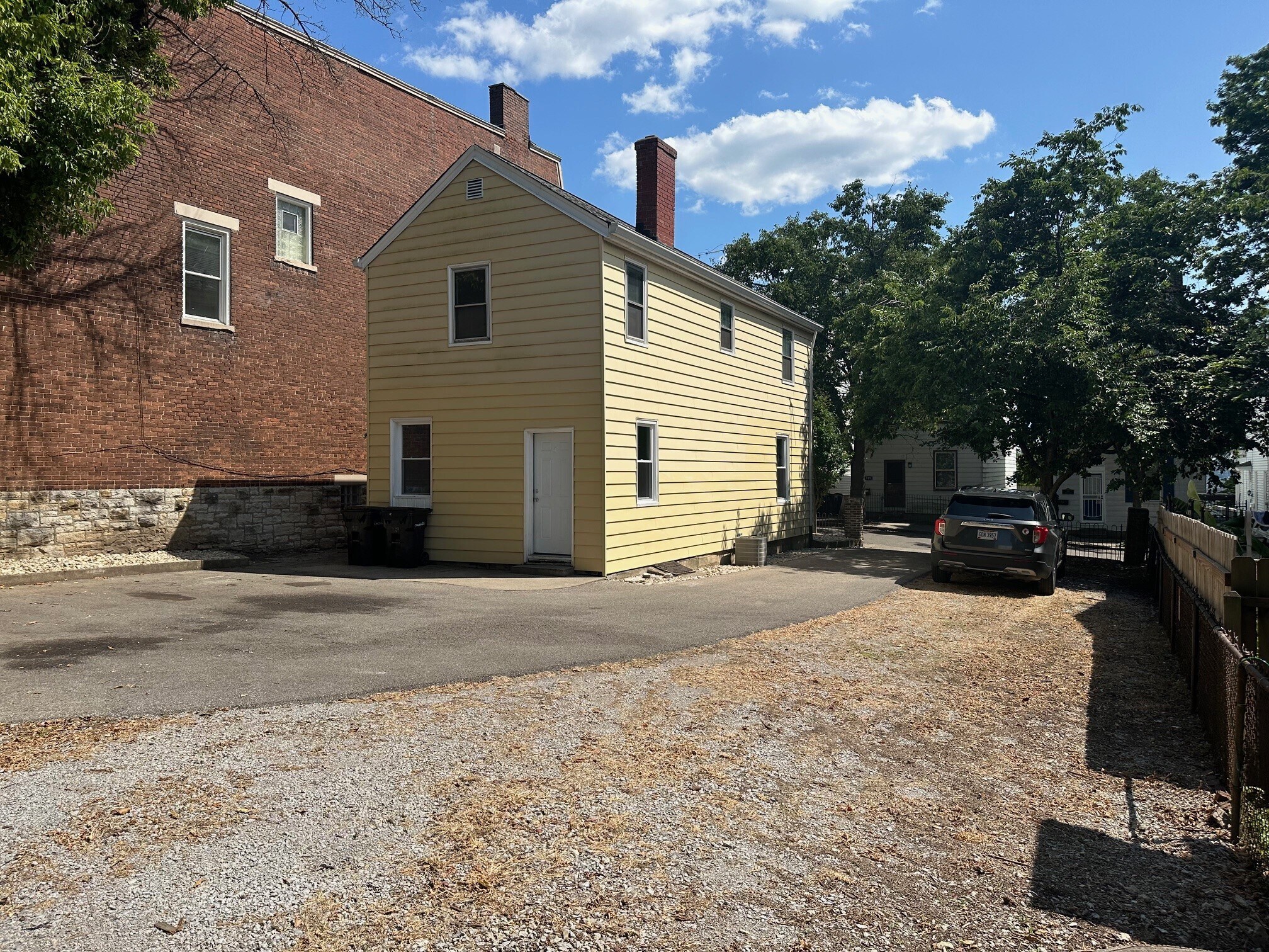 Rrear Exterior with Driveway and Parking Area - 318 Emming St