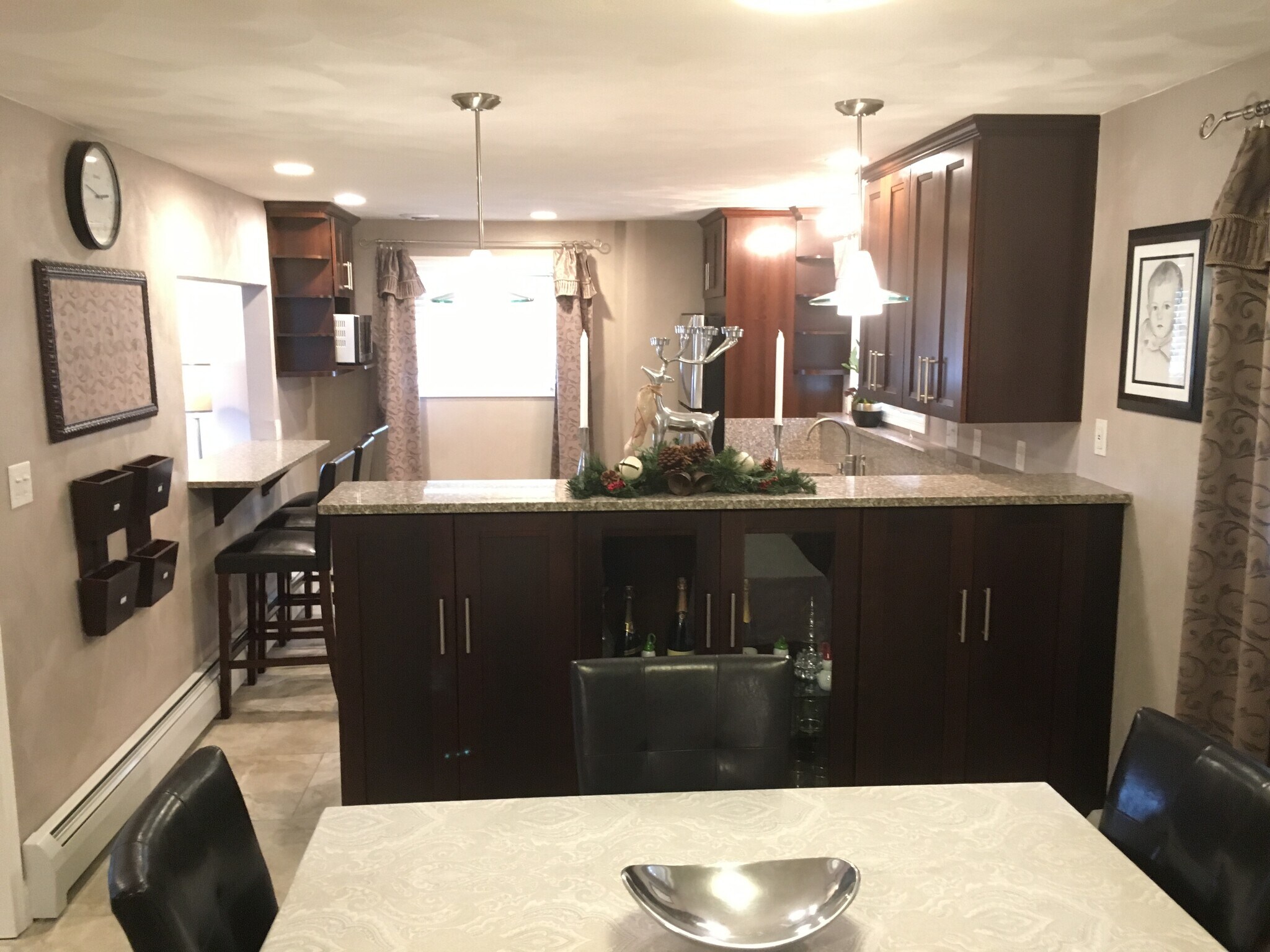 Open kitchen with granite countertops, cherry cabinets and stainless steel appliances. 24x24 Porcelain tiles and In floor radiant heating throughout. - 924 Byford Boulevard