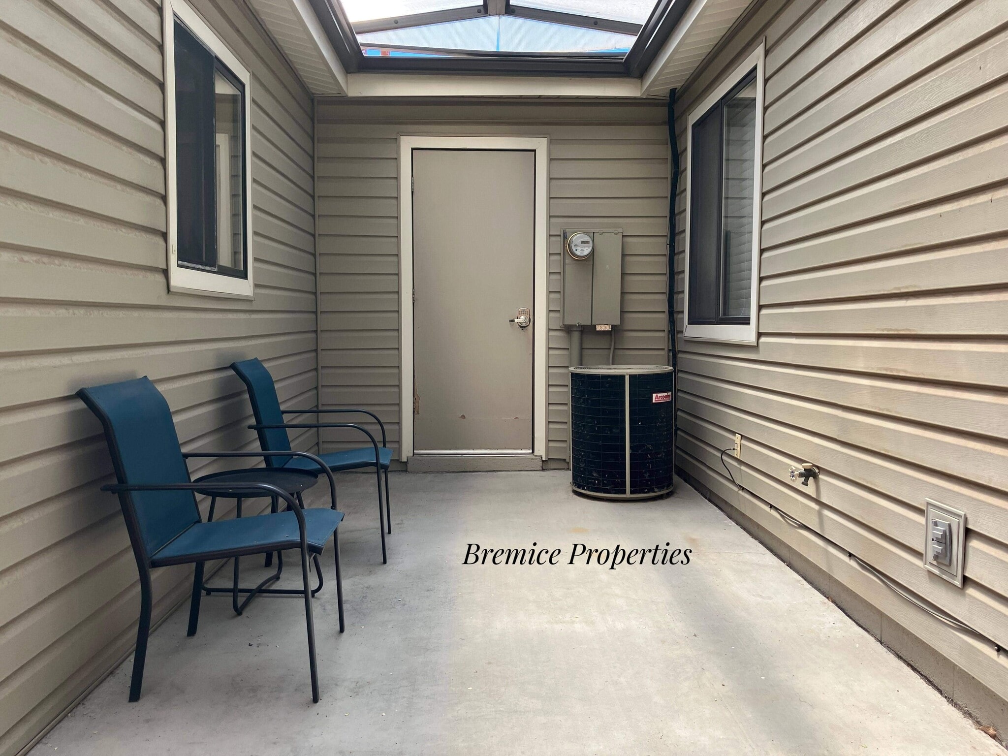 Covered Patio and Entry to Laundry Room - 345 Rim Rock Cir