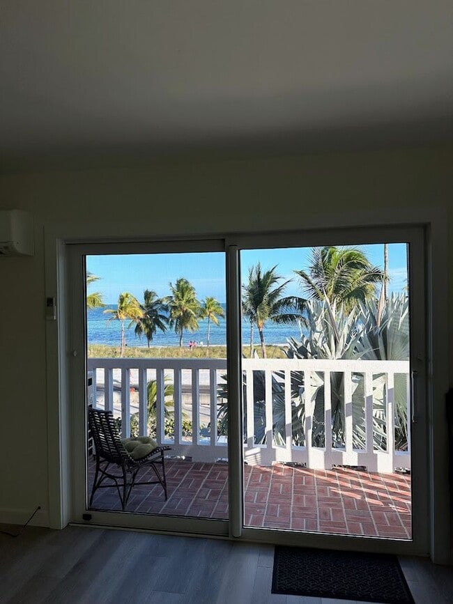 Building Photo - Oceanfront 2/1 furnished Condo