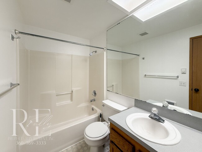 Building Photo - Vaulted Ceilings, Skylights & a True Primary Suite in This Gig Harbor Duplex