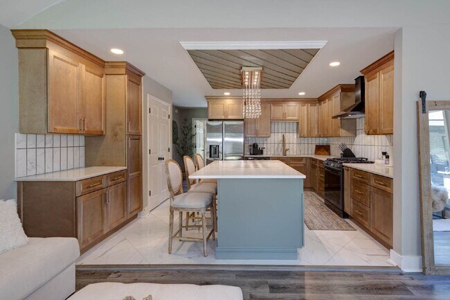 Building Photo - COMING SOON · Designer Renovation · Covered Deck Pavilion · 2-Car Garage · Lawn Care Included