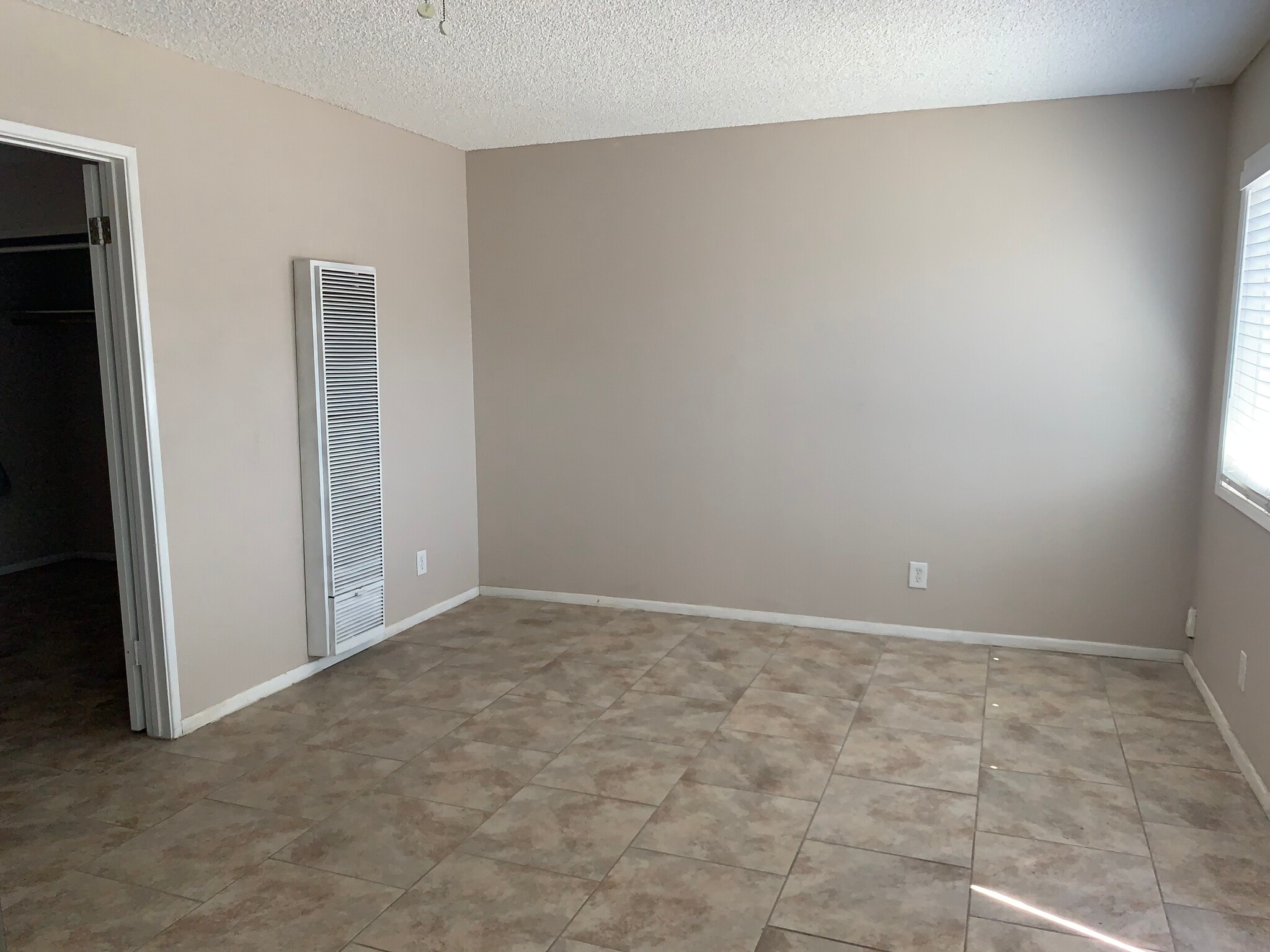 Living area with gas wall heater - 516 W Atkins Ave