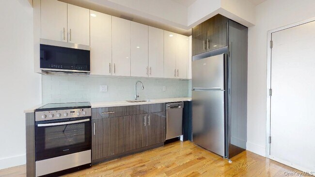 Building Photo - 138-28 Queens Blvd