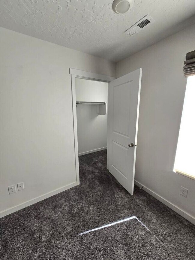 Building Photo - Nearly New, Well Appointed Modern Townhouse w 2 car attached garage