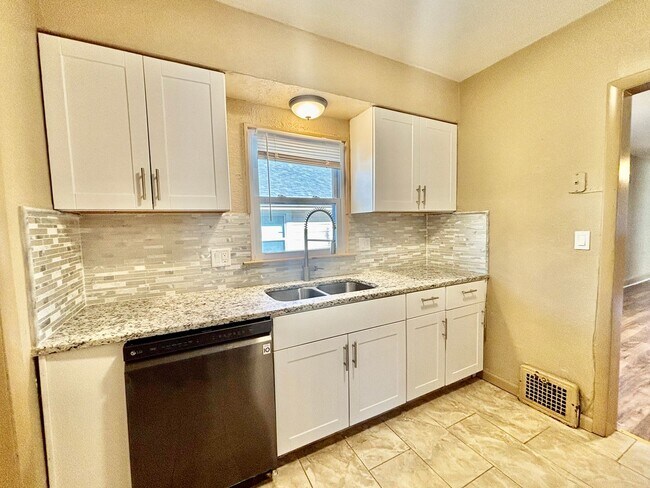 Building Photo - Spacious 2-Bedroom + Den Home with Ample Parking & Backyard!